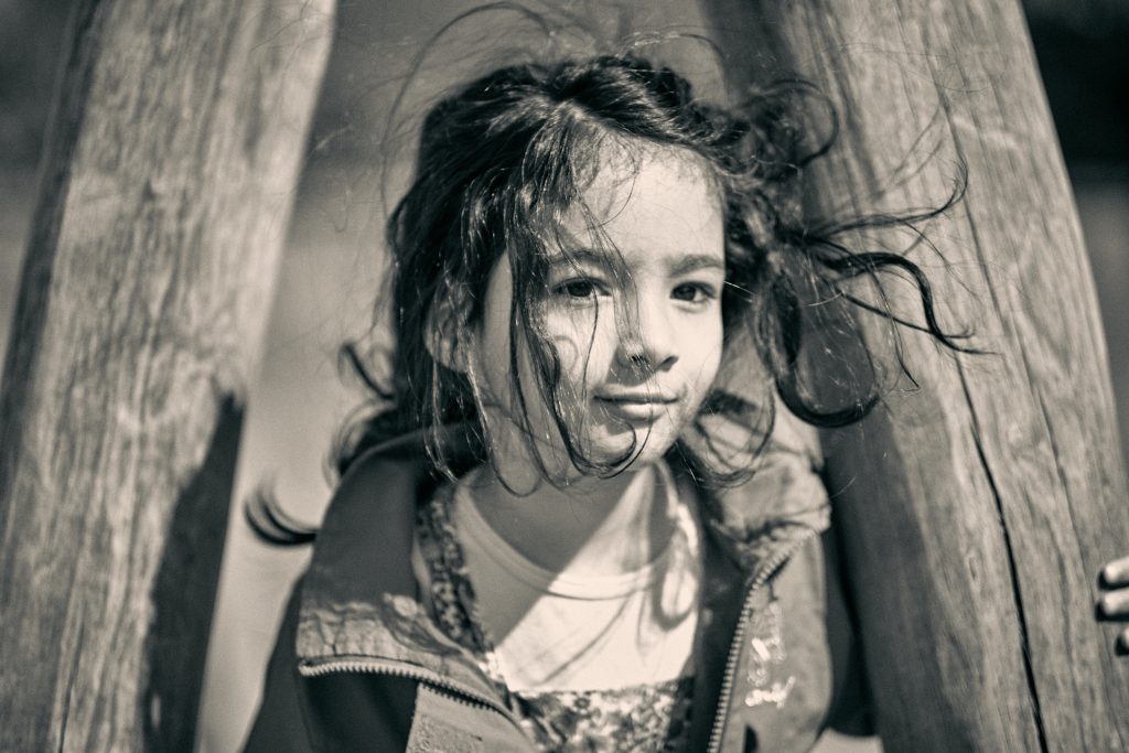 Black and white portrait of girl with wet hair wearing jacket, artistic lighting with dramatic shadows - © Pascal Recchia. All rights reserved.